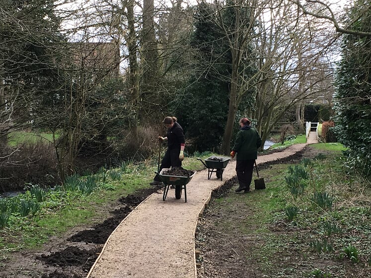 gardening by a path